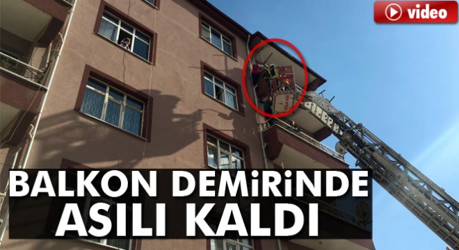 Balkon demirinde asılı kalan kızı ölümden itfaiye kurtardı